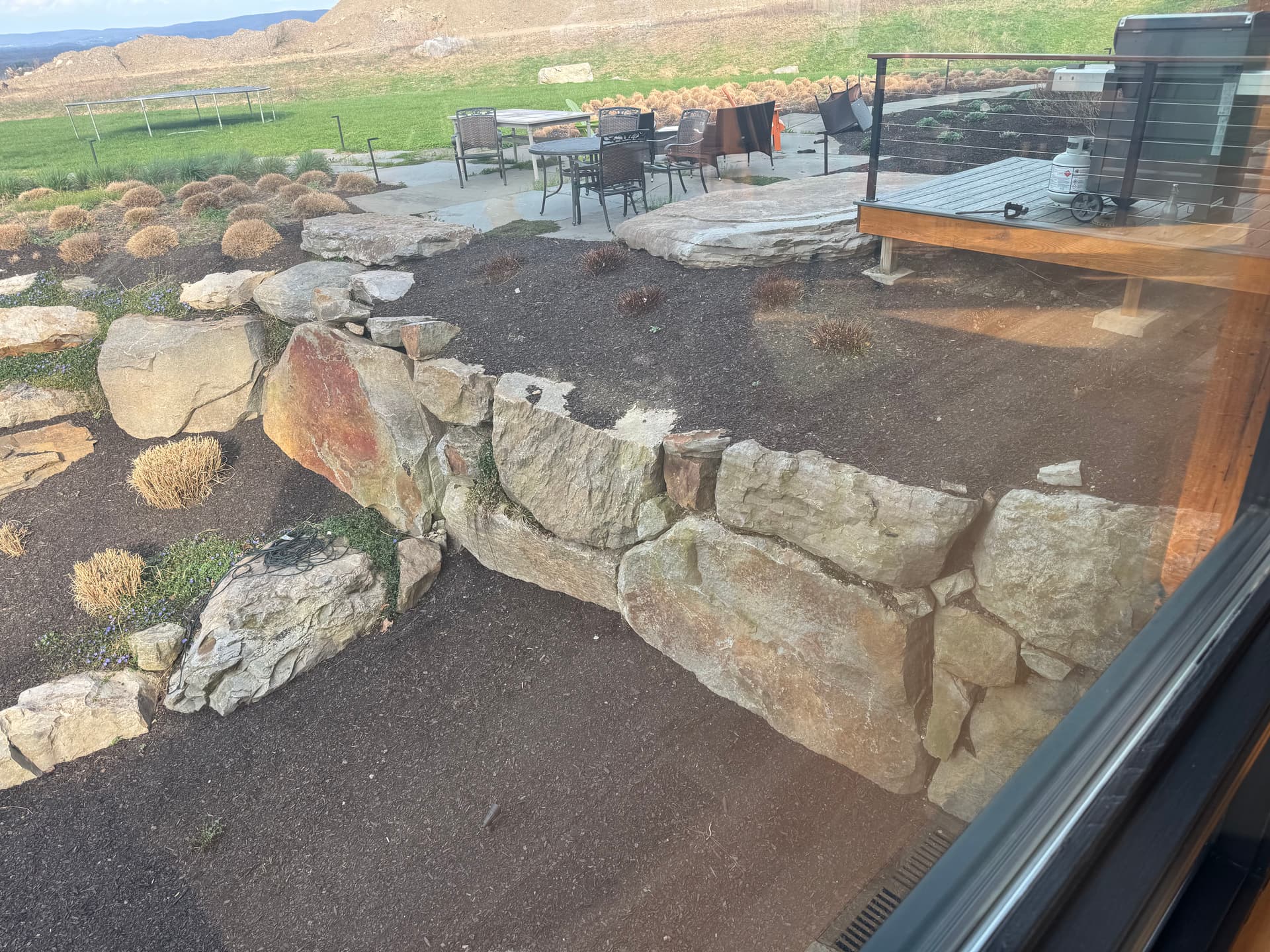 Boulder Walls, Bluestone Walkways and Layered Plantings Done Right