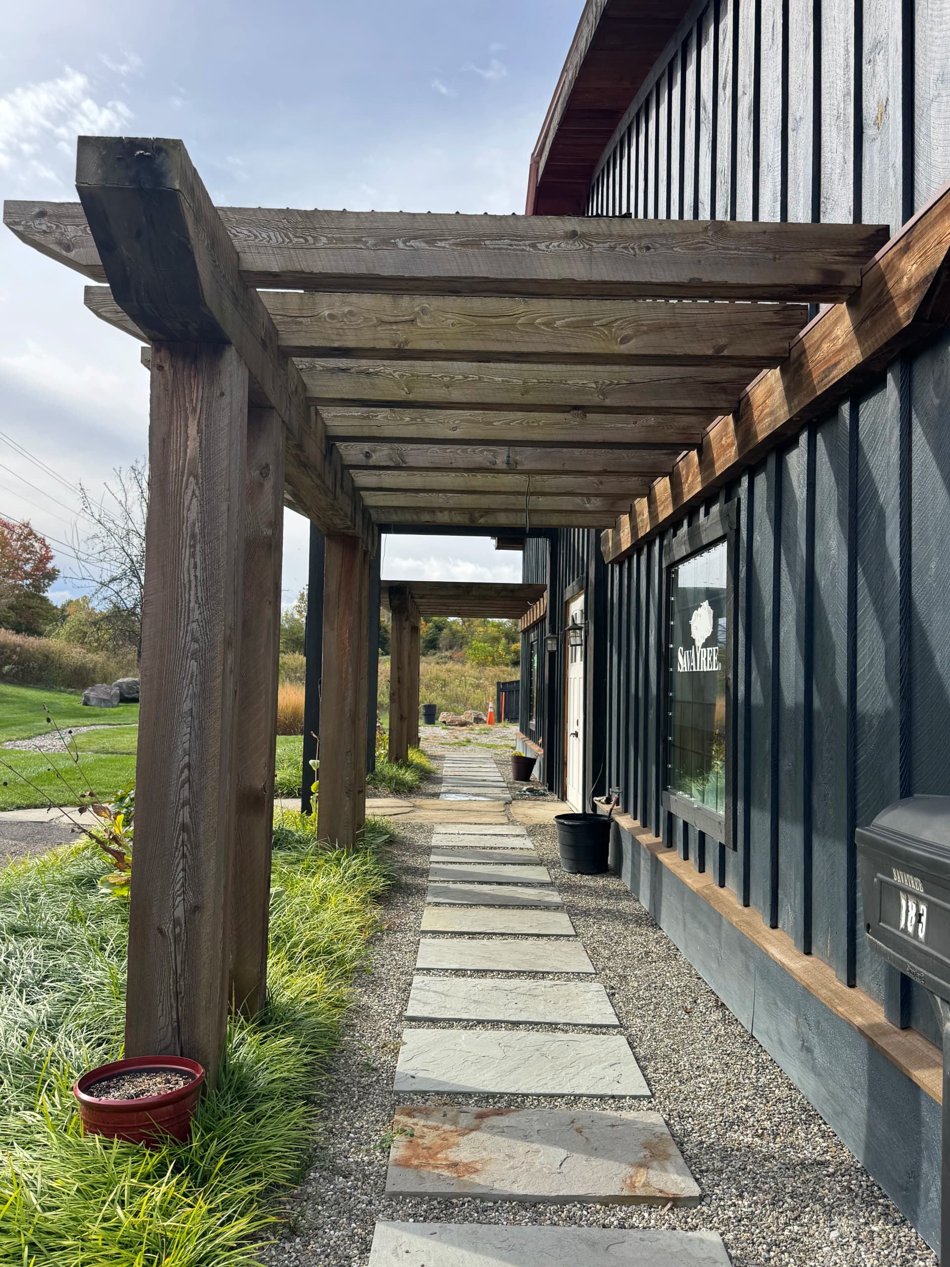 Pergola and Bluestone Path Give This Front Entrance Real Character image