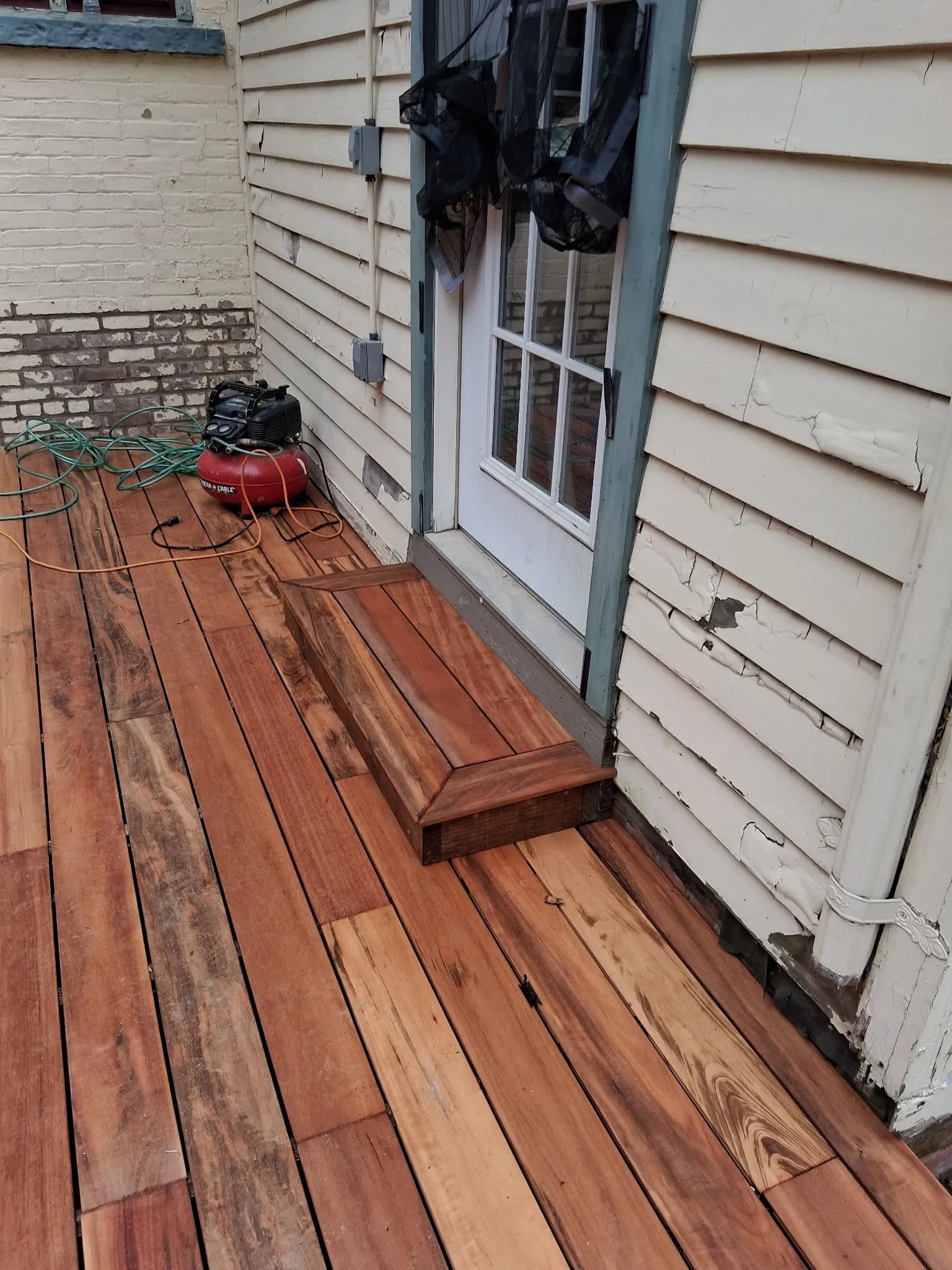 Tigerwood Deck Build with Natural Stone Steps to Lower Yard image